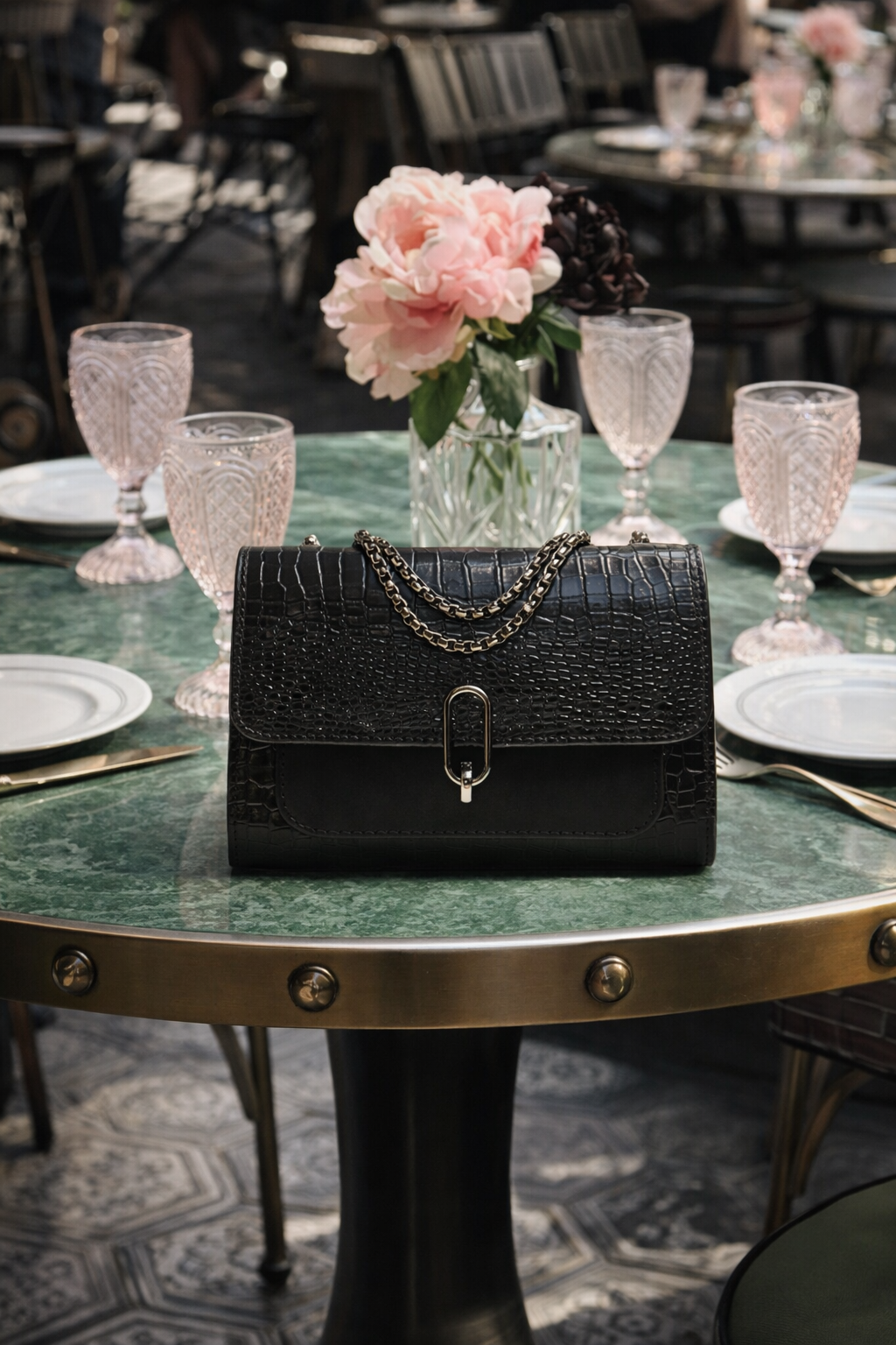 Elegant black croc handbag with statement chain strap