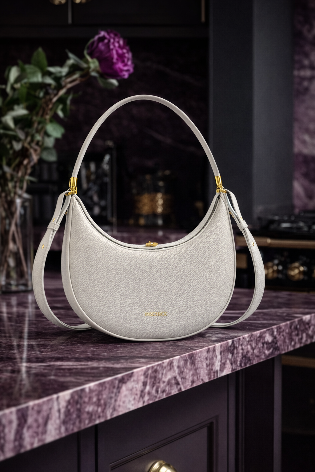Light grey minimalist crescent bag with elegant structured shape