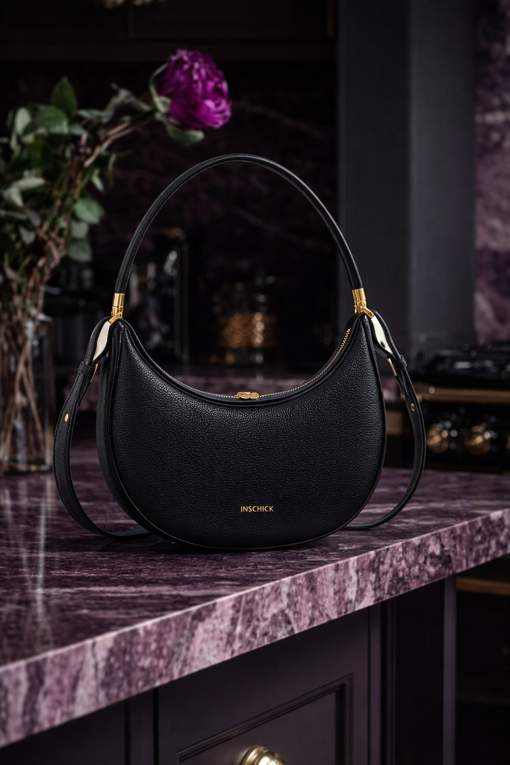 black crescent shoulder bag with minimalist curved design