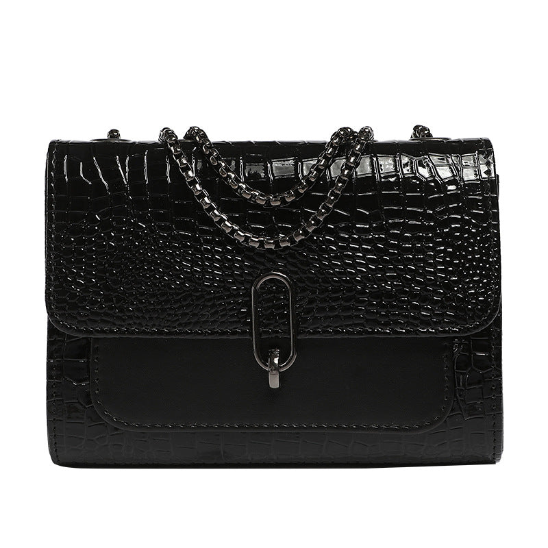 Black crocodile textured crossbody clutch with chain strap