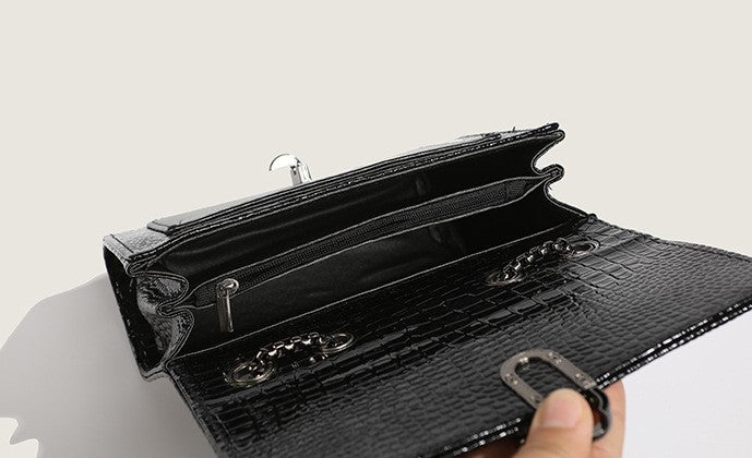 Stylish black crocodile evening purse with chain strap