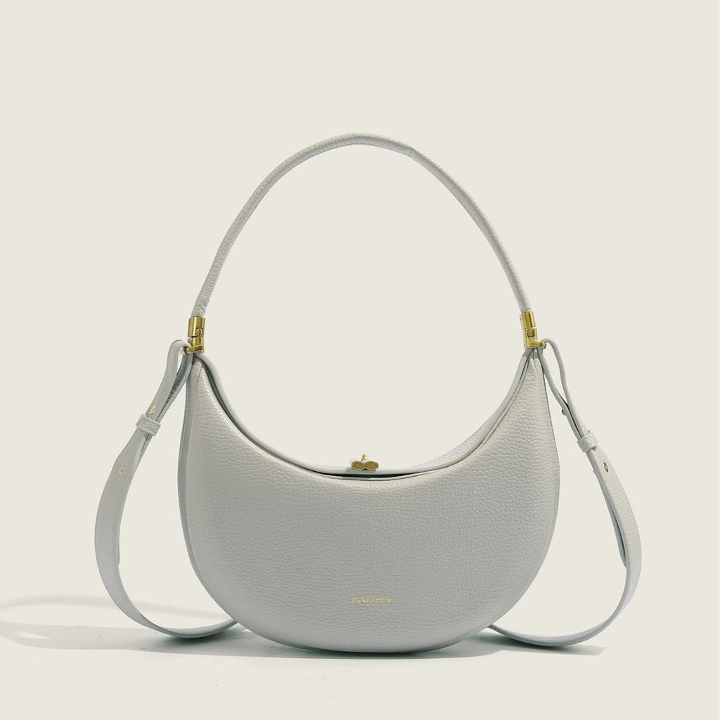 Light grey minimalist crescent bag with elegant structured shape