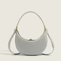 Light grey minimalist crescent bag with elegant structured shape