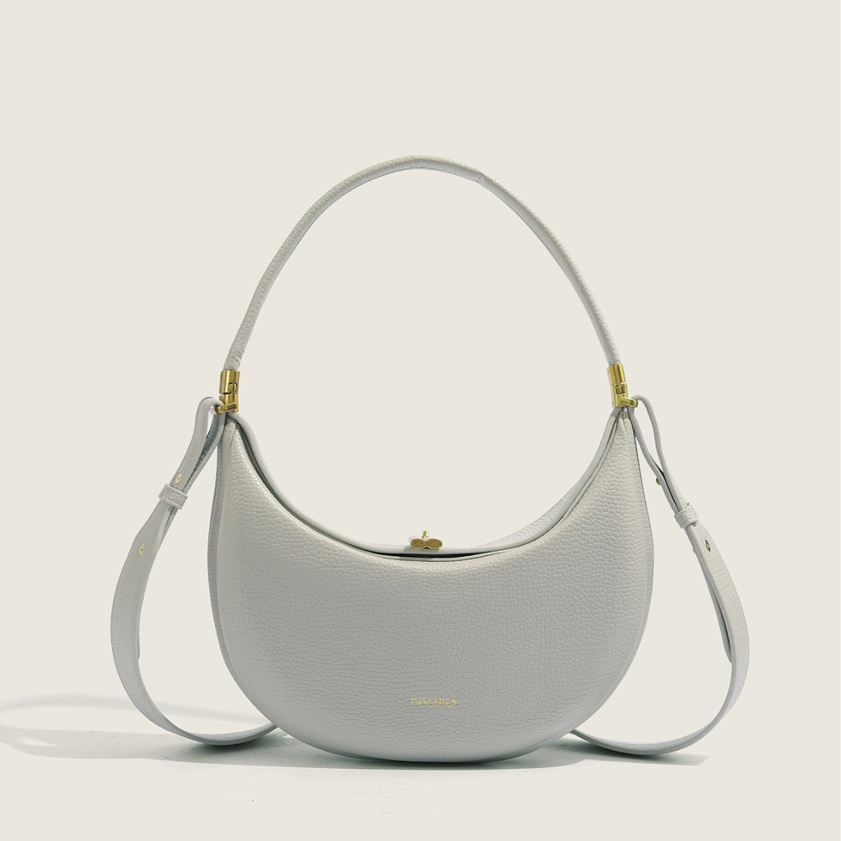 Light grey minimalist crescent bag with elegant structured shape