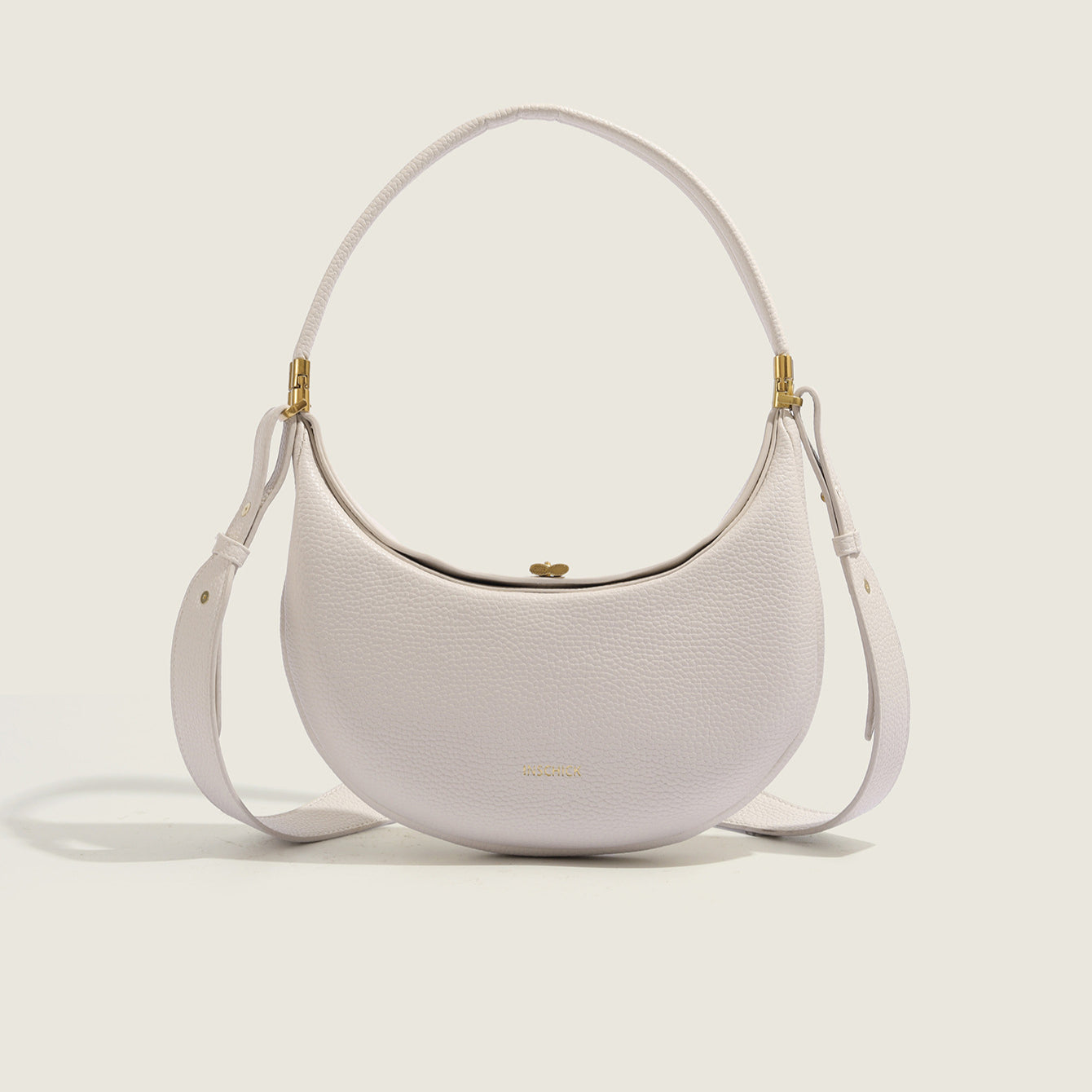 white crescent shoulder bag with minimalist curved design